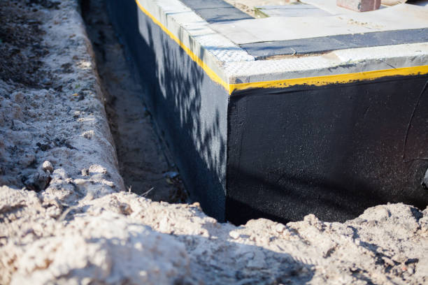 Professional Basement Waterproofing technician working in Newport, NC